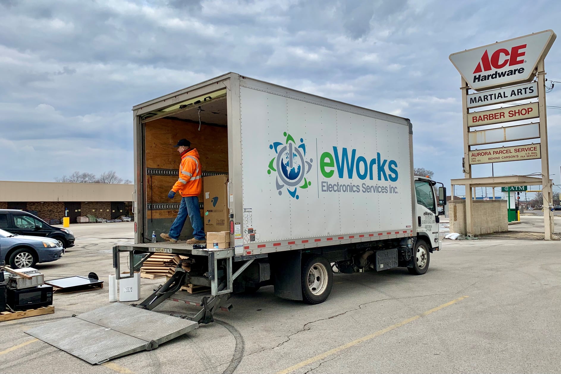 eWorks box truck near Ace Hardware sign